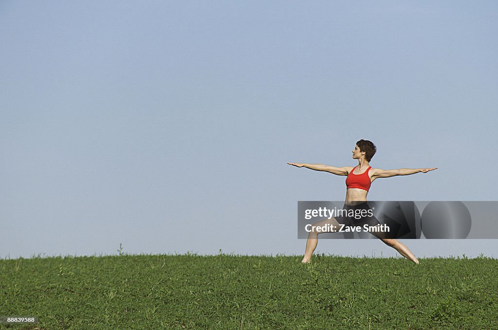 Woman doing yoga outdoors