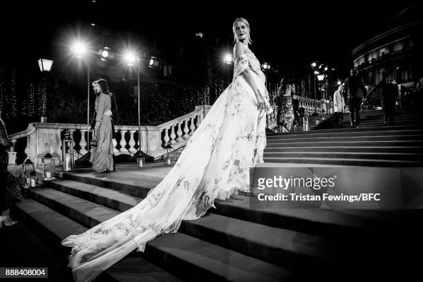 Poppy Delevingne walks the red carpet during The Fashion Awards 2017 in partnership with Swarovski at Royal Albert Hall on December 4, 2017 in...
