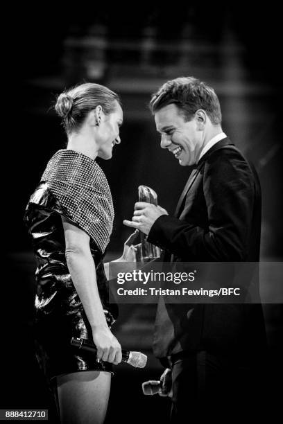 Amber Valletta presents Jonathan Anderson with the Accessories Designer of the Year award on stage during The Fashion Awards 2017 in partnership with...