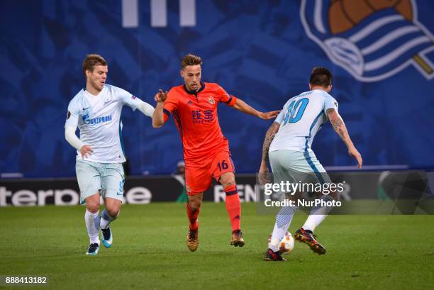 Sergio Canales of Real Sociedad vies with Aleksandr Kokorin and Emiliano Rigoni of Zenit during the UEFA Europa League Group L football match between...