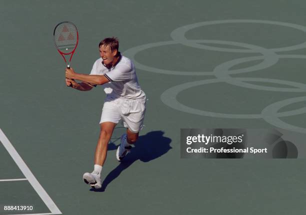 Yevgeny Kafelnikov of Russia in action during a Men's Singles match in the tennis event at the Summer Olympic Games at the NSW Tennis Centre in...