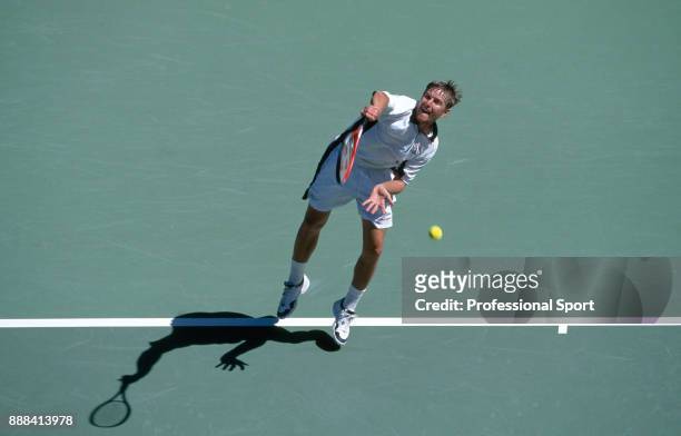 Yevgeny Kafelnikov of Russia in action during a Men's Singles match in the tennis event at the Summer Olympic Games at the NSW Tennis Centre in...