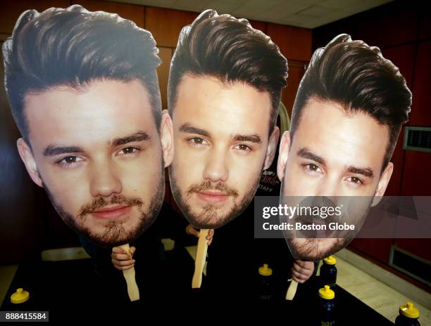 Fans hold giant cutouts of former One Direction member Liam Payne before his performance at Notre Dame Academy in Hingham, MA on Dec. 7, 2017....