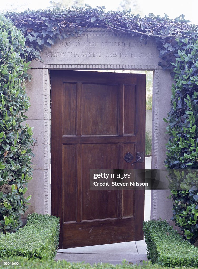 Ivy growing around doorway to garden