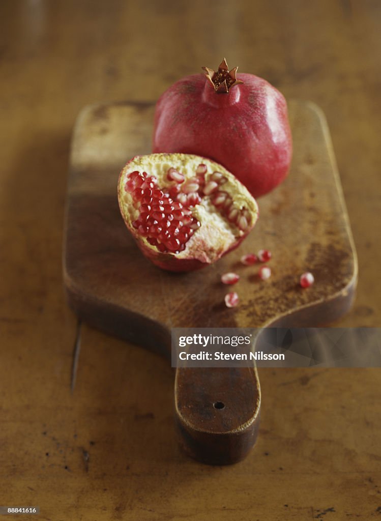 Pomegranate on cutting board