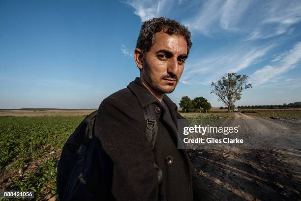 Mohammad Hameh, a 30 years old Arabic teacher from the city of Amuda, located in the Kurdish region of Rojava, Syria, poses for a portrait photograph...
