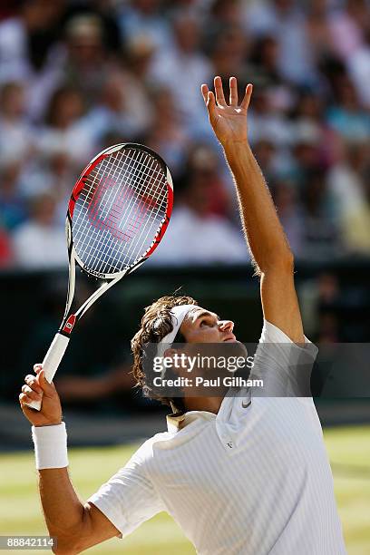 Roger Federer of Switzerland serves during the men's singles final match against Andy Roddick of USA on Day Thirteen of the Wimbledon Lawn Tennis...