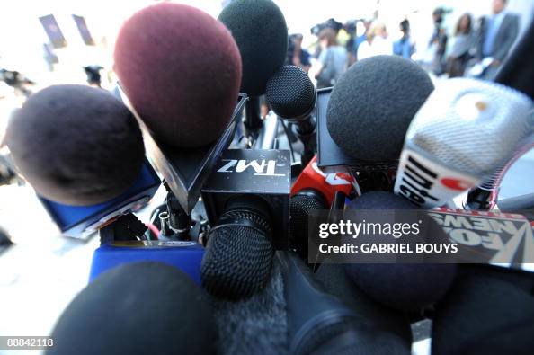 A TMZ microphone is seen between other m A TMZ microphone is seen between other m