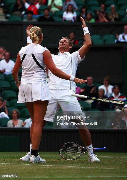 Mark Knowles of Bahamas and Anna-Lena Groenefeld of Germany celebrate victory during the mixed doubles final match against Leander Paes of India...