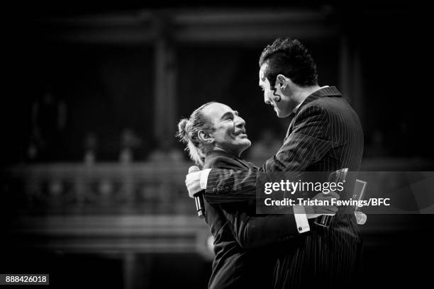 Charles Jeffrey , winner of the British Emerging Talent Menswear award, and John Galliano on stage during The Fashion Awards 2017 in partnership with...