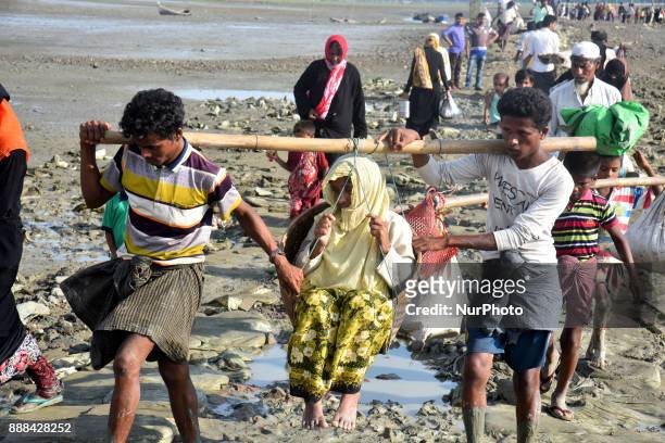 Hundreds of Rohingya people crossing Bangladesh's border as they flee from Buchidong at Myanmar after crossing the Nuf River Shah Porir Dwip Island...