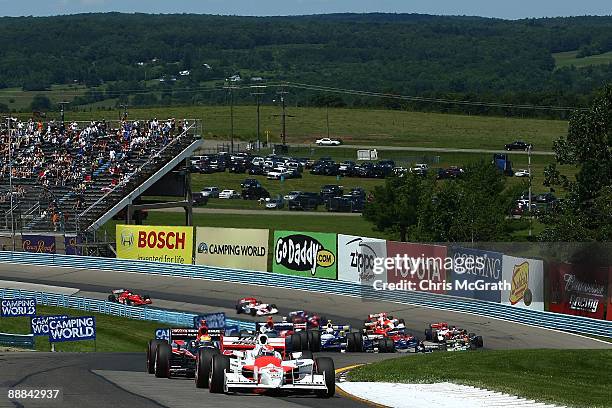 Ryan Briscoe, in the Team Penske Dallara Honda leads the field for the start of the IRL Indycar Series Camping World Grand Prix on July 5, 2009 at...