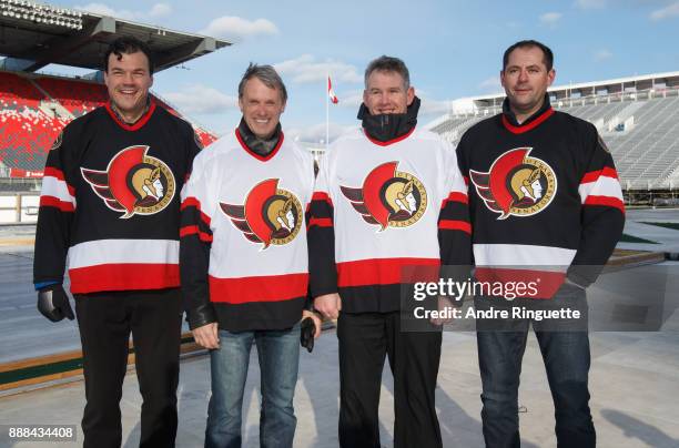 Senators alumni Rob Murphy, Laurie Boschman, Shaun Van Allen and Chris Phillips pose for a group photo during media availability ahead of their...