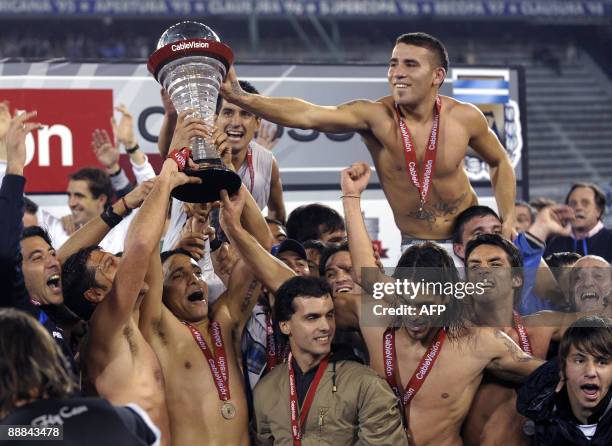 Velez Sarsfield's players celebrate after winning Argentina's first division football match against Huracan at Jose Amalfitani stadium in Buenos...