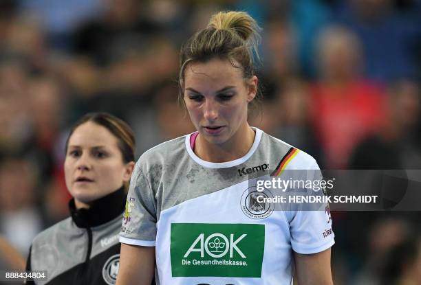 Germany's Anna Loerper and Angie Geschke react during the preliminary round IHF Womens World Championship handball match Germany vs Netherlands in...