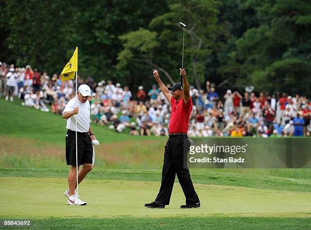 Tiger Woods celebrates his win on the 18th green after the final round of the AT&T National at Congressional Country Club on July 5, 2009 in...