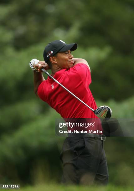 Tiger Woods hits his tee shot on the 16th hole during the final round of the AT&T National hosted by Tiger Woods at Congressional Country Club on...