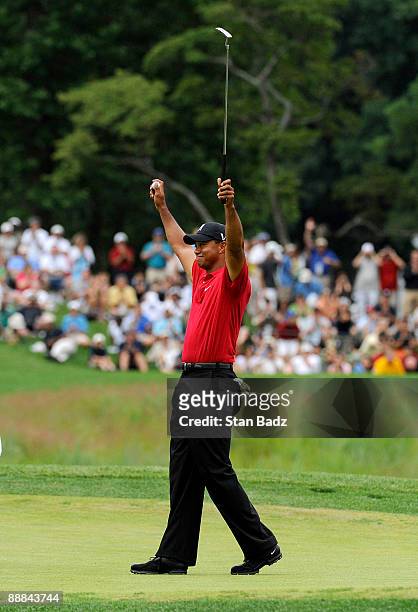 Tiger Woods celebrates his win on the 18th green after the final round of the AT&T National at Congressional Country Club on July 5, 2009 in...