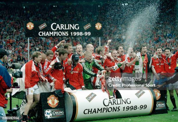 Manchester United line up for a group photo after winning FA Carling Premiership after the last home game of the season against Tottenham Hotspur at...