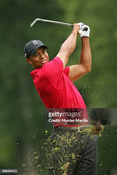 Tiger Woods hits his third shot on the 11th hole during the final round of the AT&T National hosted by Tiger Woods at Congressional Country Club on...