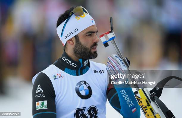 Simon Fourcade of France in action at the shooting range prior to the 10 km Men's Sprint during the BMW IBU World Cup Biathlon on December 8, 2017 in...