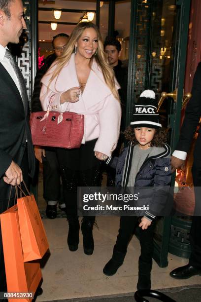 Singer Mariah Carey and son Moroccan Scott Cannon leave the 'Hermes' store on December 8, 2017 in Paris, France.