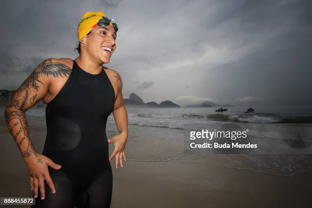 Brazilian Marathon Swimming competitor Ana Marcela Cunha smiles during a grid start-up match and press conference at Copacabana beach on December 8,...