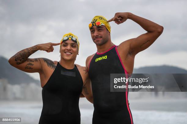 Brazilian Marathon Swimming competitors Ana Marcela Cunha and Fernando Ponte pose for photographers during a grid start-up match and press conference...