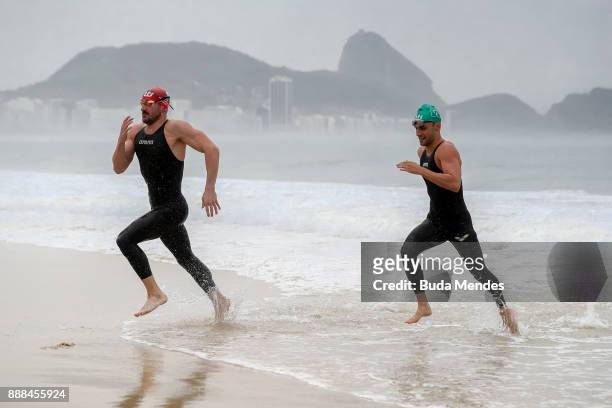 Brazilian Marathon Swimming competitor Leonardo de Deus competes during a grid start-up match at Copacabana beach on December 8, 2017 in Rio de...