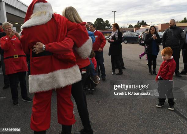 Someone maybe on the naughty list as Santa greets volunteers and families before the start of the Denver Santa Claus Shop on December 8, 2017 in...