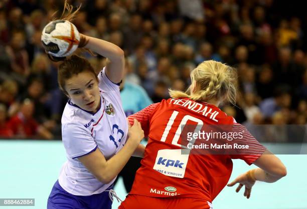 Kathrine Heindahl of Denmark challenges Anna Vyakhireva of Russia during the IHF Women's Handball World Championship group C match between Denmark...