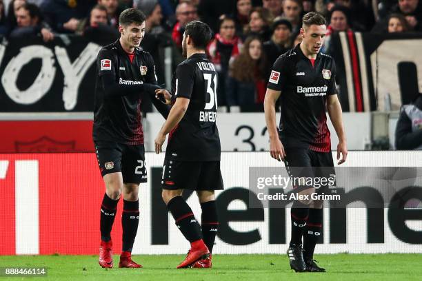 Kai Havertz of Bayer Leverkusen celebrates with Kevin Volland after scoring his team's first goal to make it 0:1 during the Bundesliga match between...