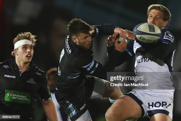 Ali Price of Glasgow Warriors vies with Francois Steyn of Montpellier during the European Rugby Champions Cup match between Glasgow Warriors and...