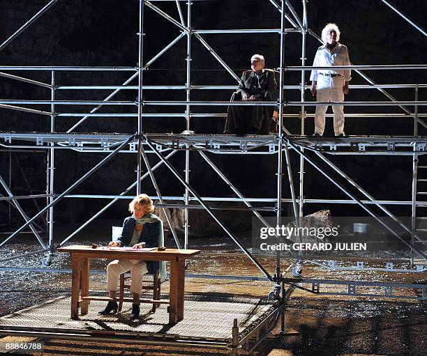 Actors Jeanne Moreau , Jerome Koenig and Gerard Benhamou perform a scene of the play "La Guerre des fils de lumière contre les fils des ténèbres"...