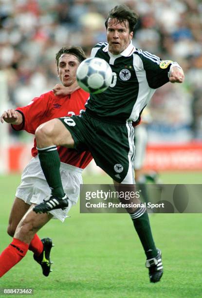 Lothar Matthaus of Germany holds off Gary Neville of England during a UEFA Euro 2000 group match at the Stade du Pays de Charleroi on June 17, 2000...