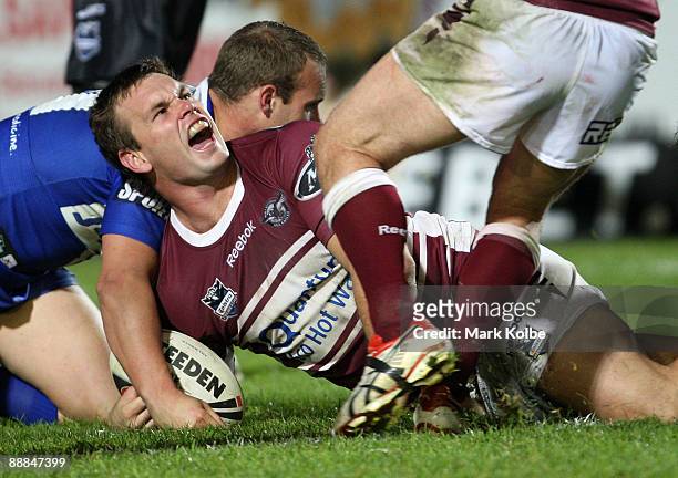 Josh Perry of the Eagles celebrates after scoring a try during the round 18 NRL match between the Manly Warringah Sea Eagles and the Bulldogs at...