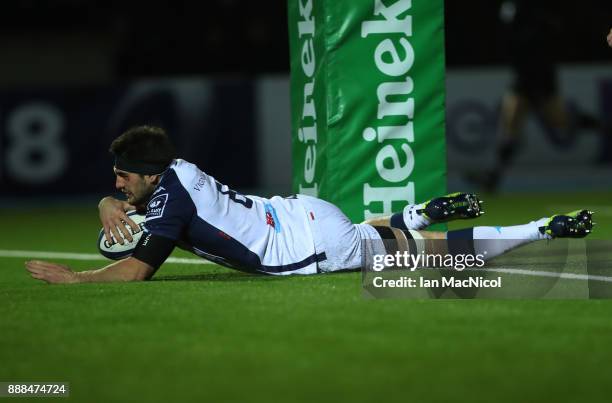 Kelian Galletier of Montpellier breaks through to score his team's secondt try during the European Rugby Champions Cup match between Glasgow Warriors...