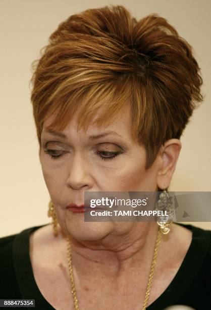 Beverly Young Nelson looks down as she listens to attorney Gloria Allred during a news conference on December 08, 2017 in Atlanta. Beverly Young...