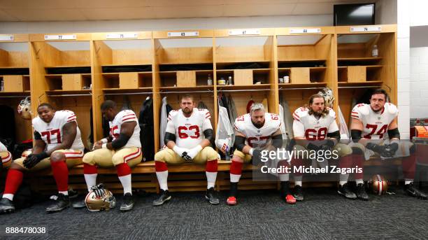 Trent Brown, Laken Tomlinson, Brandon Fusco, Daniel Kilgore, Zane Beadles, Joe Staley of the San Francisco 49ers relax in the locker room prior to...