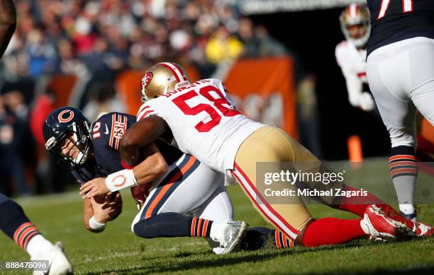 Elvis Dumervil of the San Francisco 49ers sacks Mitchell Trubisky of the Chicago Bears during the game at Soldier Field on December 3, 2017 in...
