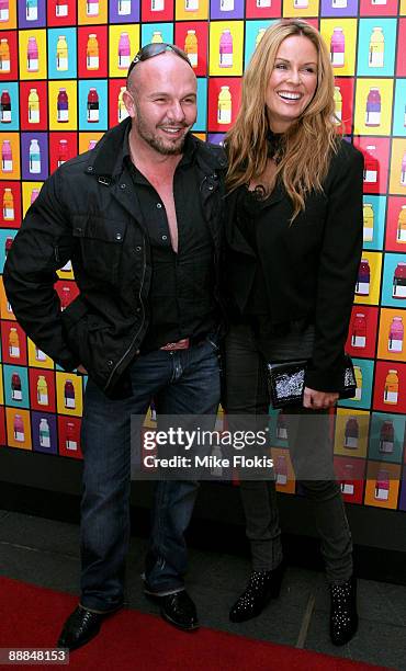 Fashion designer Alex Perry and Charlotte Dawson arrive at the GLACÉAU vitaminwater hearts russell james event at Customs House on July 6, 2009 in...