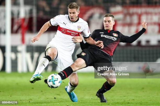 Lars Bender of Bayer Leverkusen and Simon Terodde of VfB Stuttgart battle for the ball during the Bundesliga match between VfB Stuttgart and Bayer 04...