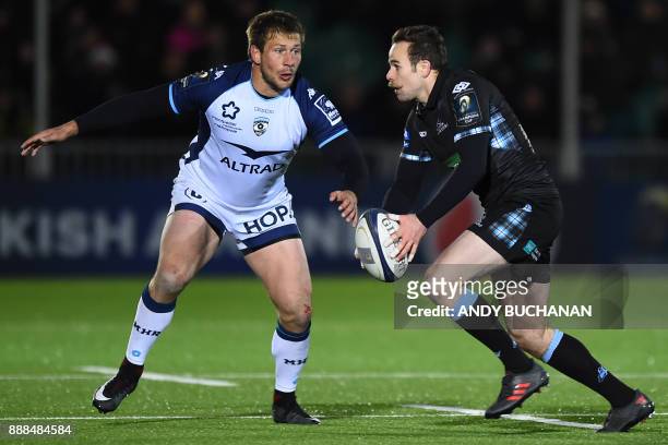 Glasgow Warriors' Scottish full-back Ruaridh Jackson looks to pass the ball during the European Champions Cup pool 3 rugby union match between...