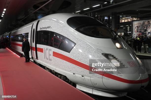 The ICE Inter-City-Express Train arrives at the Berlin Central Train Station or Hauptbahnhof during the first journey of the high speed track that...