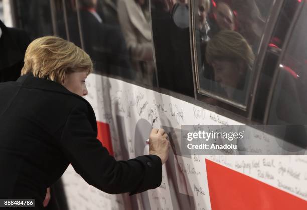 German Chancellor Angela Merkel , signs the ICE Inter-City-Express Train during the first journey of the high speed track that connect the German's...