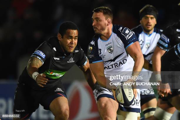 Montpellier's French number 8 Louis Picamoles looks to pass the ball during the European Champions Cup pool 3 rugby union match between Glasgow...