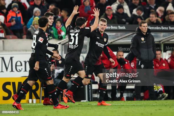 Lars Bender of Bayer Leverkusen celebrates with his team-mates after scoring his team's second goal to make it 0:1 during the Bundesliga match...