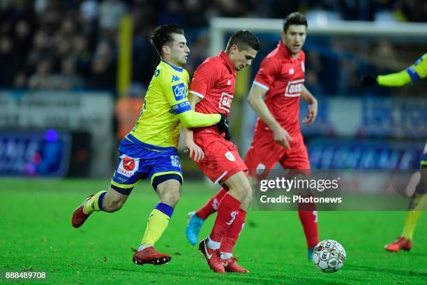 Marin Razvan midfielder of Standard Liege is challenged by Tuur Dierckx forward of Beveren during the Jupiler Pro League match between...