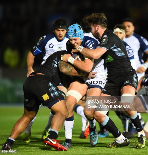 Montpellier's South African lock Nicolaas Janse van Rensburg is tackled during the European Champions Cup pool 3 rugby union match between Glasgow...