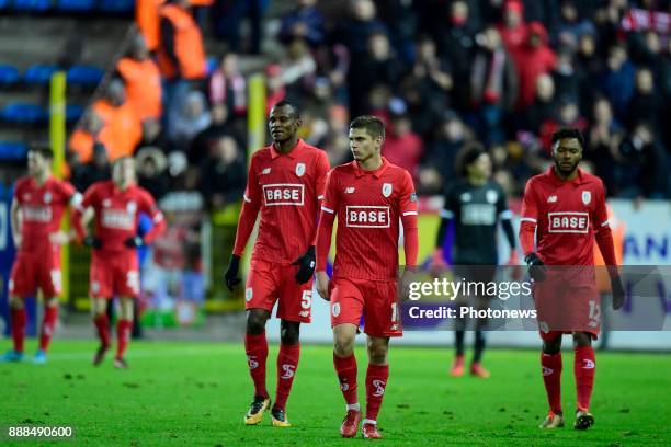 Marin Razvan midfielder of Standard Liege and Uche Henry Agbo defender of Standard Liege leaving the pitch disappointed after the defeat during the...